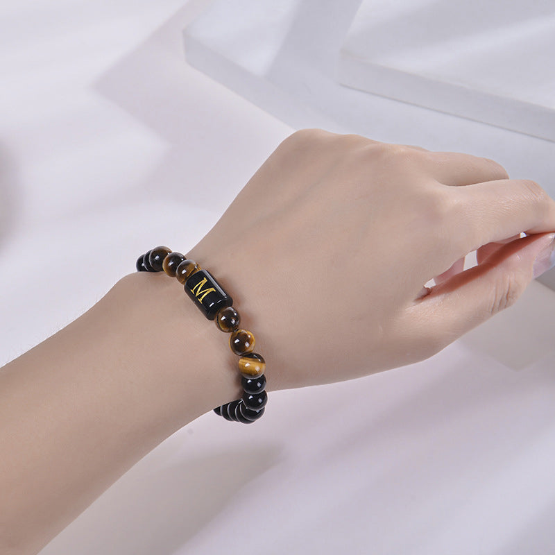 Bracciale con lettera in occhio di tigre e ossidiana