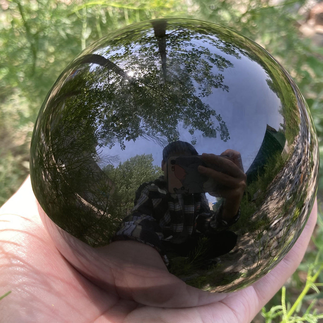 Decorazione una sfera di cristallo di ossidiana Olivenorma