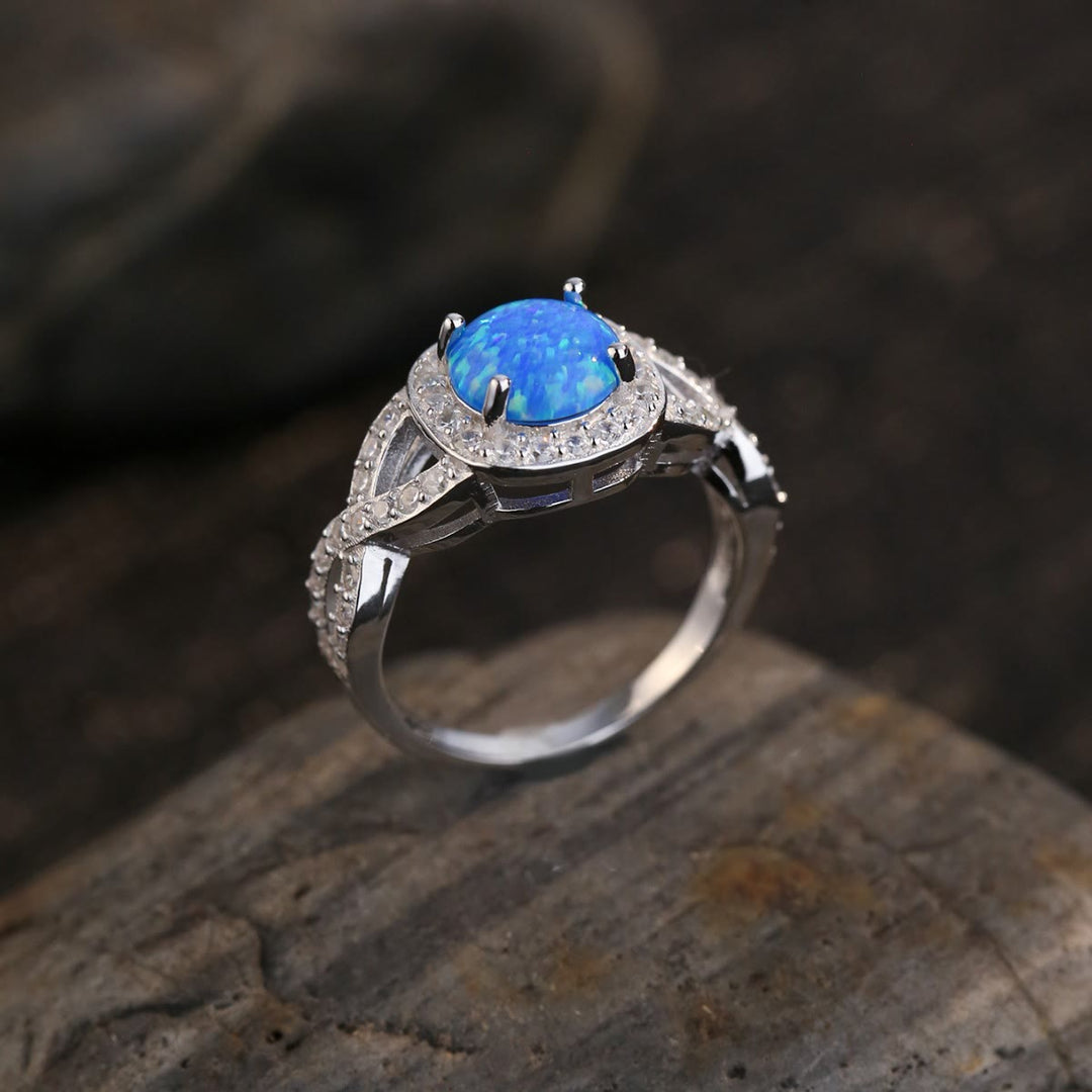 Anello Olivenorma in argento sterling 925 con zircone bianco e opale blu
