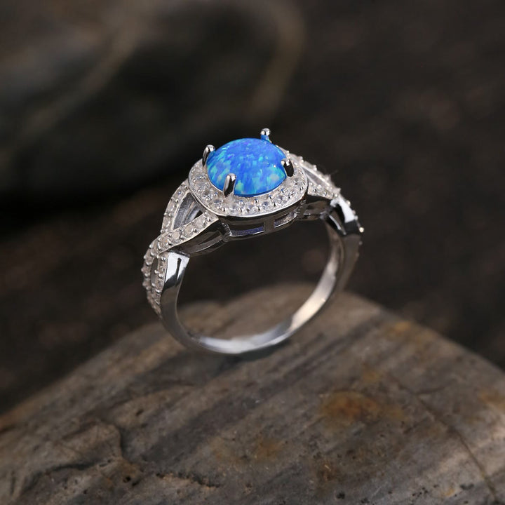 Anello Olivenorma in argento sterling 925 con zircone bianco e opale blu