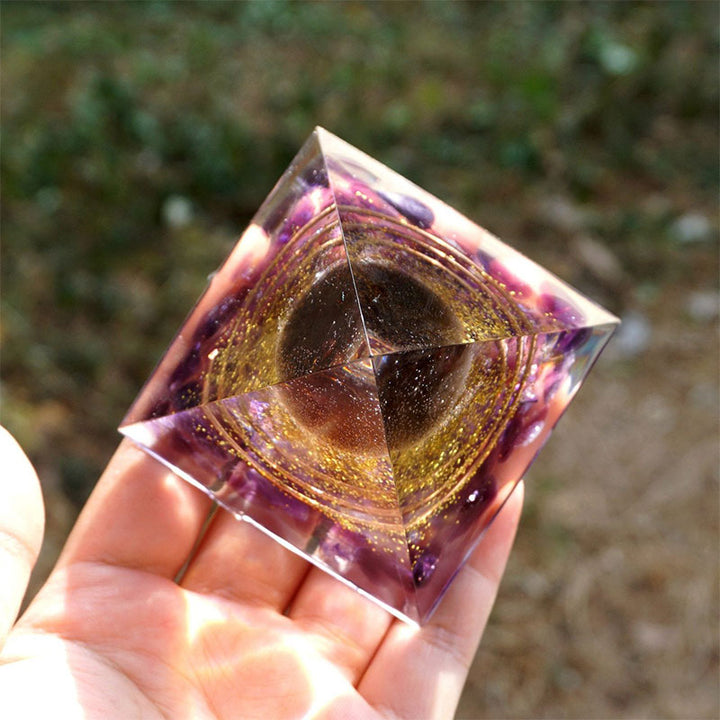 Olivenorma Sfera di quarzo fumé con piramide di orgone di ametista 