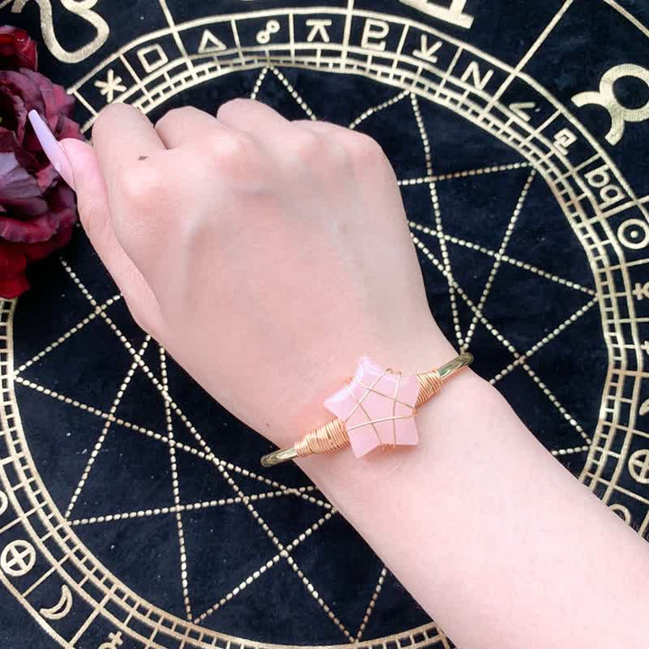 Bracciale Olivenorma con pietre preziose a forma di stella avvolte in filo d'oro