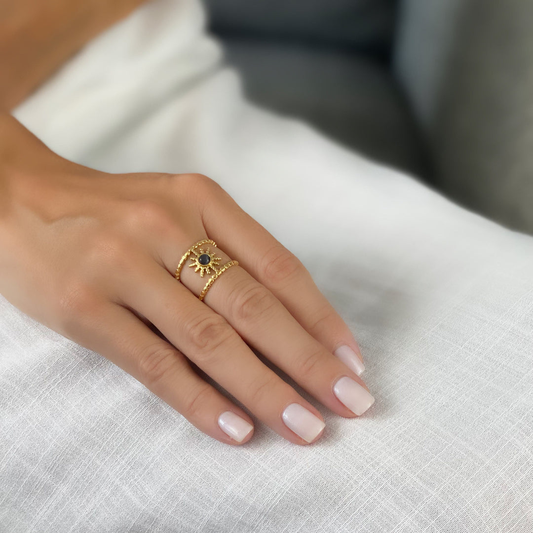 Anello con gemma a forma di stella a otto punte e doppia fila di girasole Olivenorma