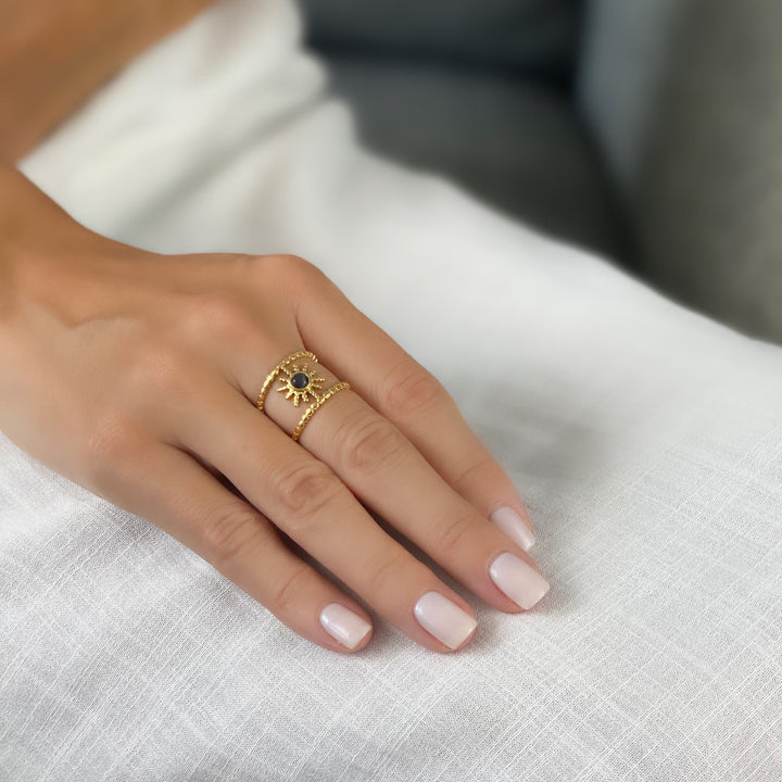 Anello con gemma a forma di stella a otto punte e doppia fila di girasole Olivenorma