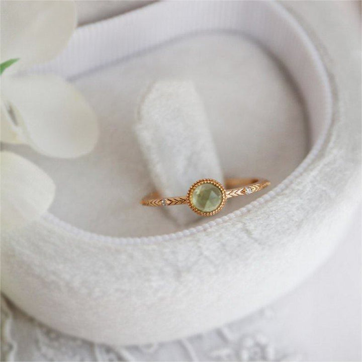 Anello Olivenorma con peridoto verde taglio rotondo naturale