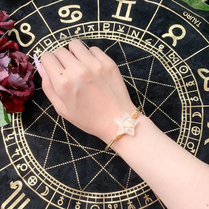 Bracciale Olivenorma con pietre preziose a forma di stella avvolte in filo d'oro