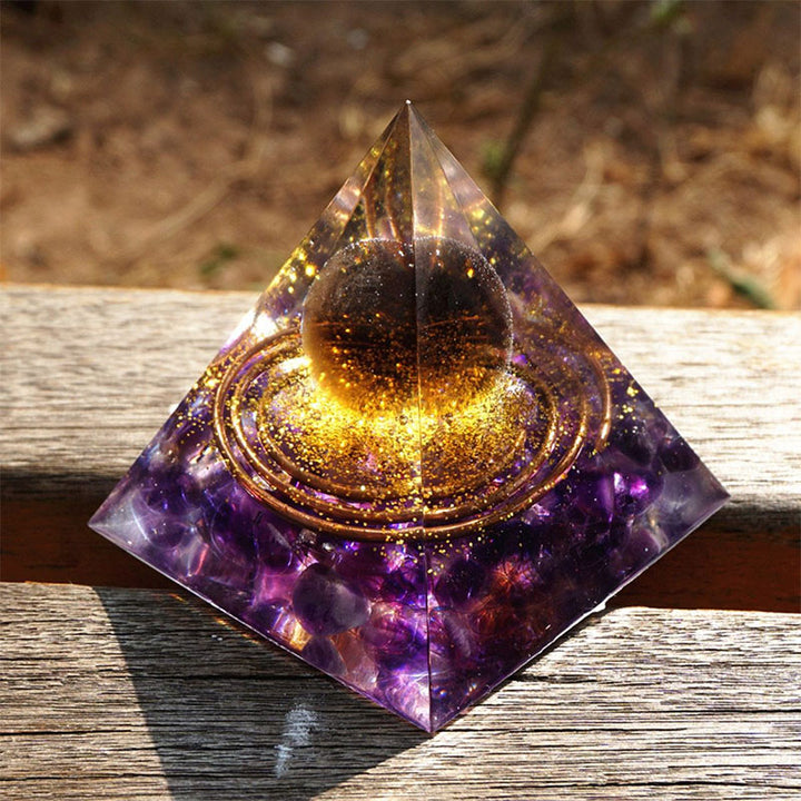 Olivenorma Sfera di quarzo fumé con piramide di orgone di ametista 