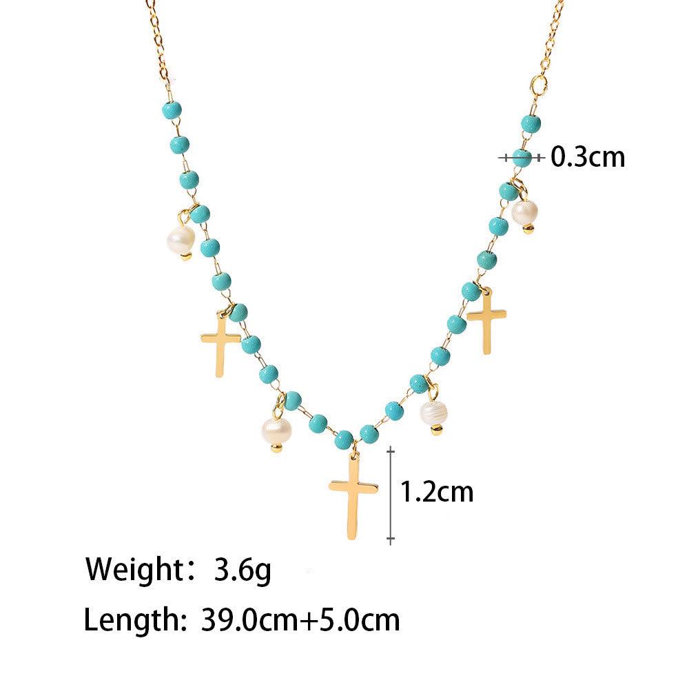 Collana con ciondolo a croce con perle turchesi Olivenorma e nappa