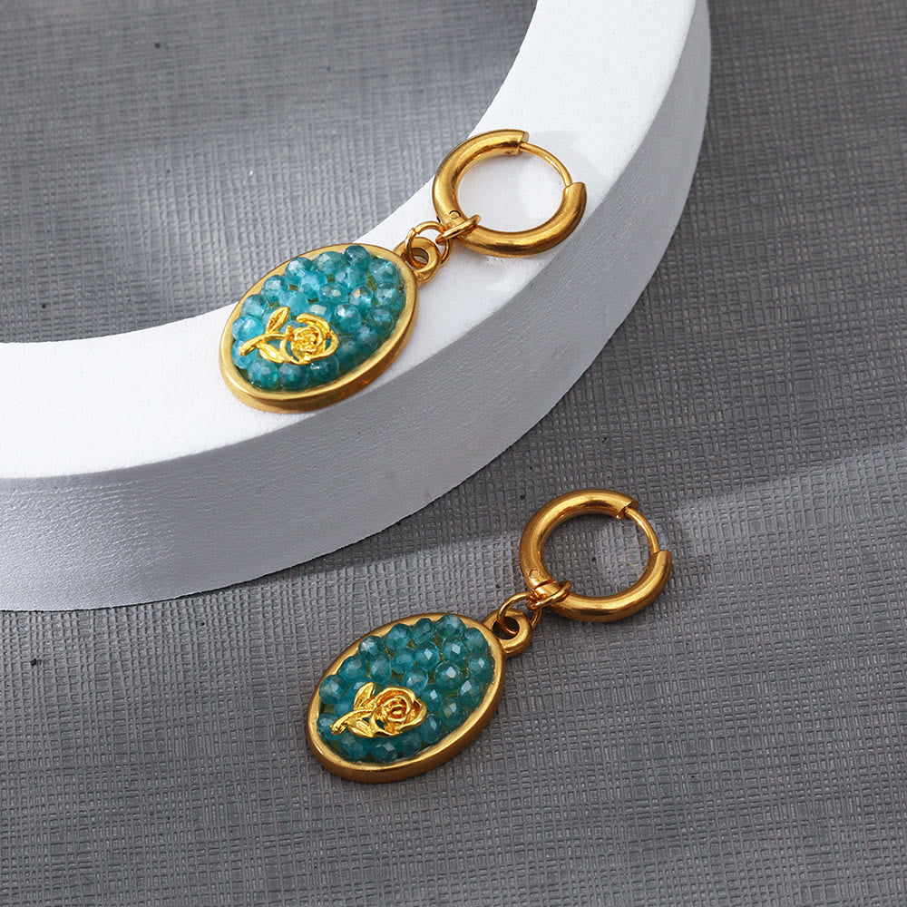Orecchini pendenti ovali in tormalina Paraiba Olivenorma con rosa schiacciata 