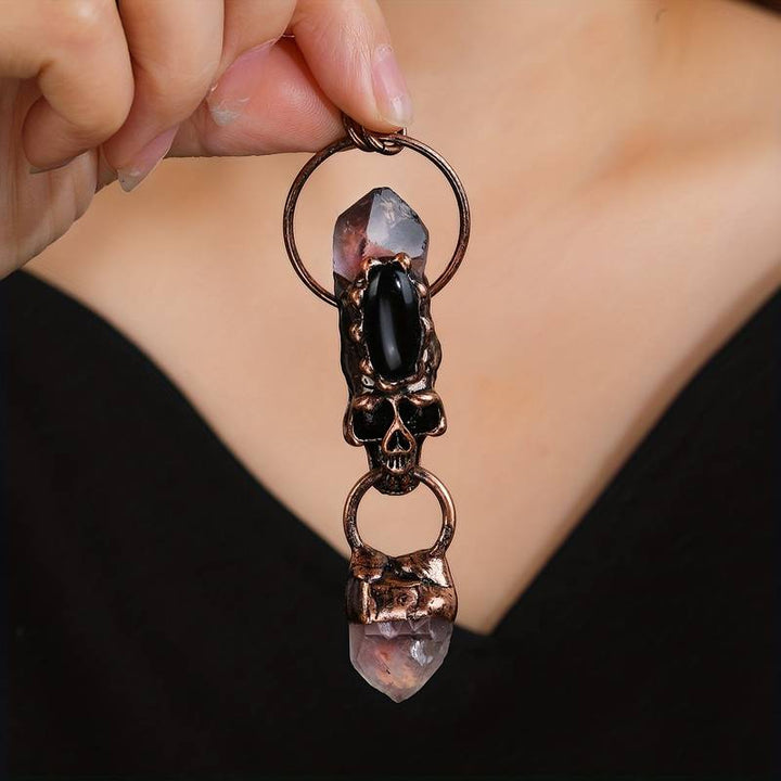 Collana con ciondolo in pietra preziosa con teschio in onice nero e ametista Olivenorma