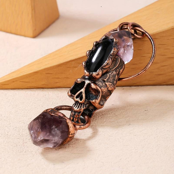Collana con ciondolo in pietra preziosa con teschio in onice nero e ametista Olivenorma