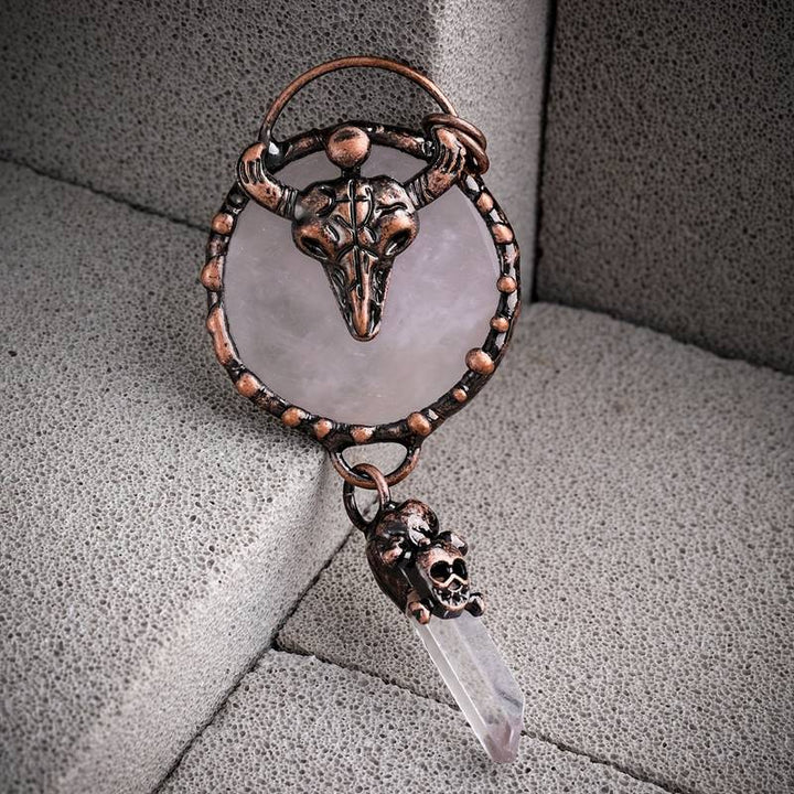 Collana Olivenorma con testa di bue in rame e pietra preziosa di quarzo trasparente