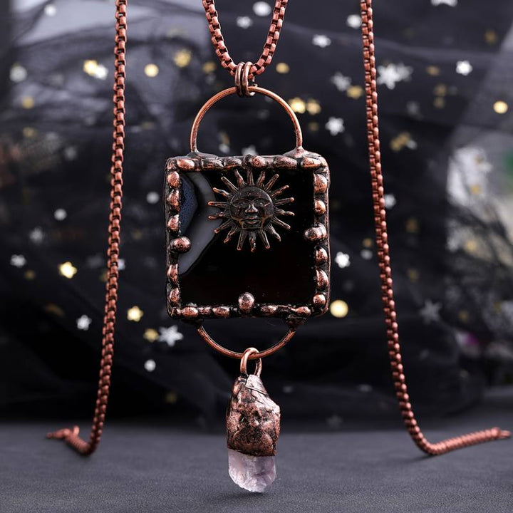 Collana con pietra preziosa irregolare in agata nera e ametista del dio del sole Olivenorma