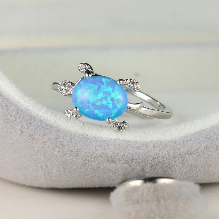 Olivenorma Anello con tartaruga marina carina e blu opale 