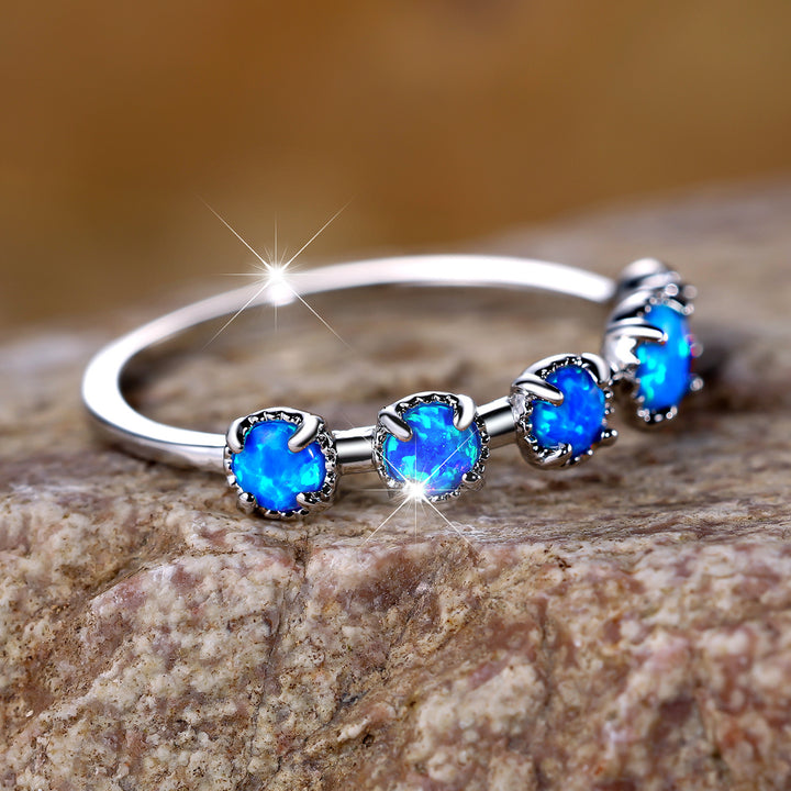 Anello Olivenorma Cinque Opali Blu Bianco Semplici Disegni