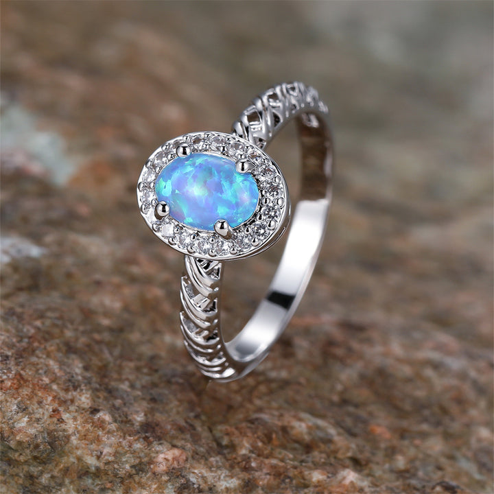 Anello con motivo a corda intrecciata con bordo ovale in opale Olivenorma