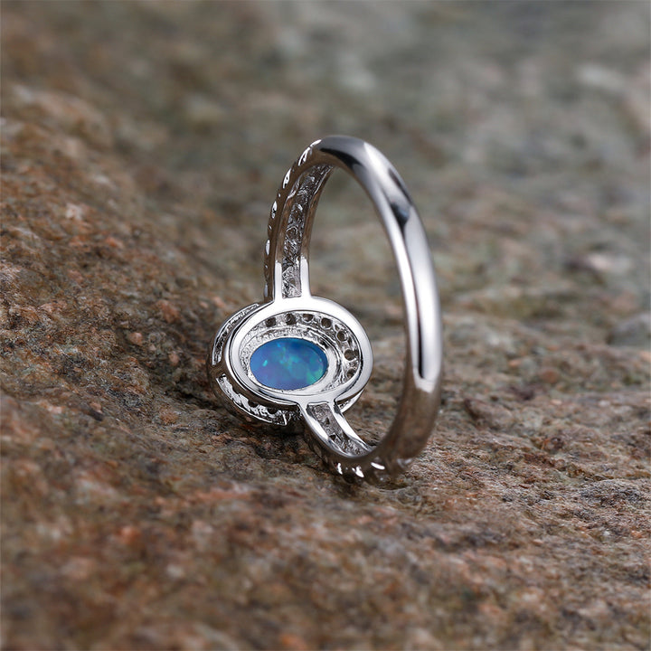 Anello con motivo a corda intrecciata con bordo ovale in opale Olivenorma