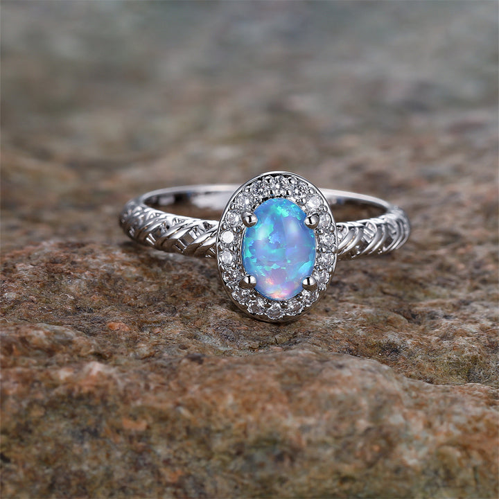 Anello con motivo a corda intrecciata con bordo ovale in opale Olivenorma
