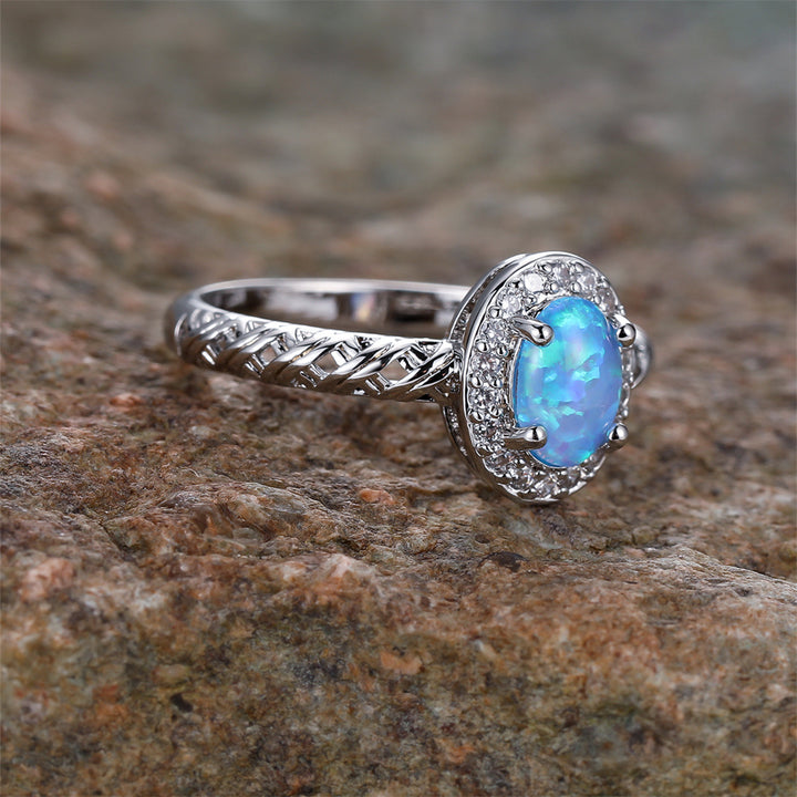 Anello con motivo a corda intrecciata con bordo ovale in opale Olivenorma