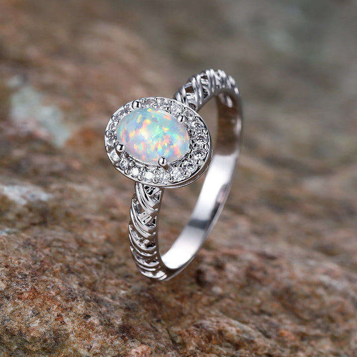 Anello con motivo a corda intrecciata con bordo ovale in opale Olivenorma