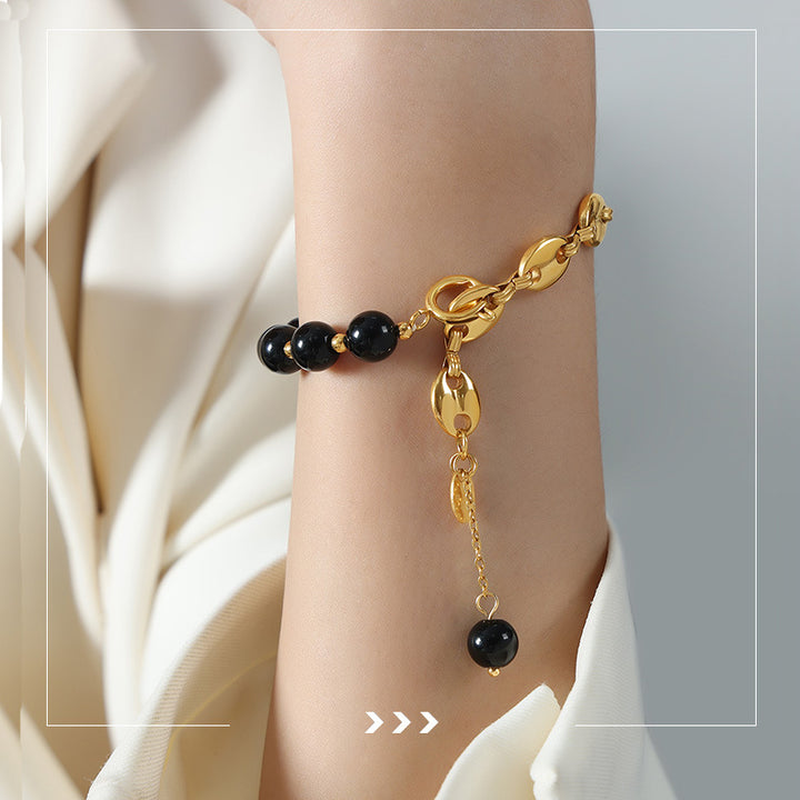 Bracciale Olivenorma in acciaio al titanio con perline di agata nera e onice 