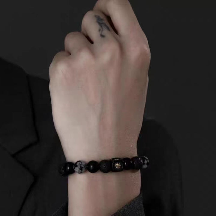 Bracciale da uomo Olivenorma con stella a otto punte in pietra lavica e ossidiana con fiocco di neve