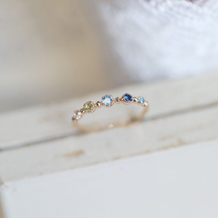 Anello regolabile Olivenorma "Summer Lake" con topazio blu 