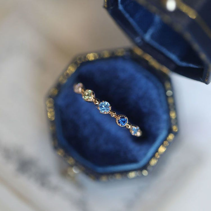 Anello regolabile Olivenorma "Summer Lake" con topazio blu 