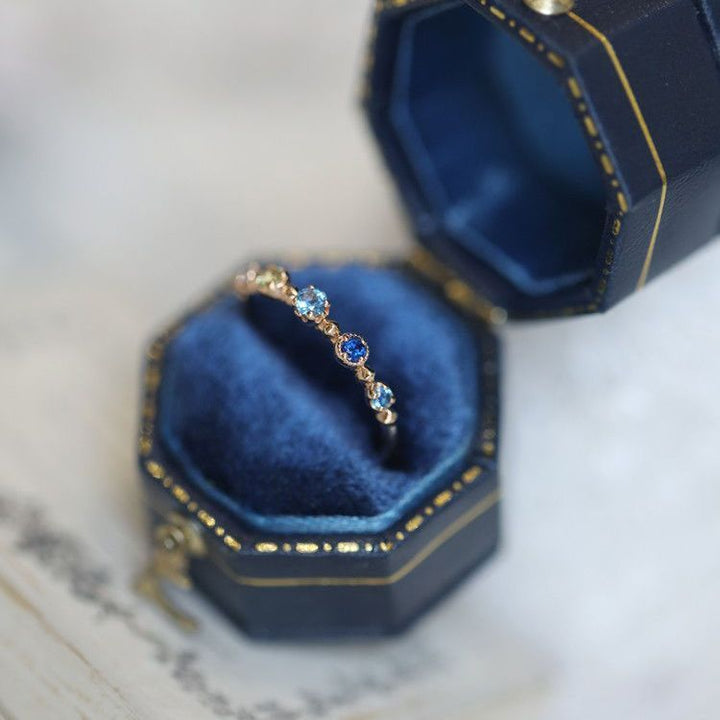 Anello regolabile Olivenorma "Summer Lake" con topazio blu 