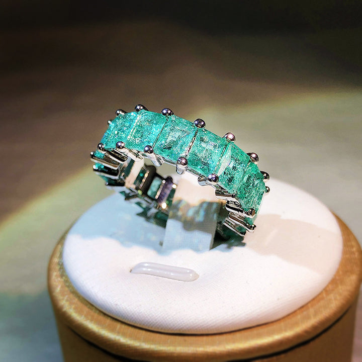 Anello quadrato affiancato con tormalina Paraiba Olivenorma