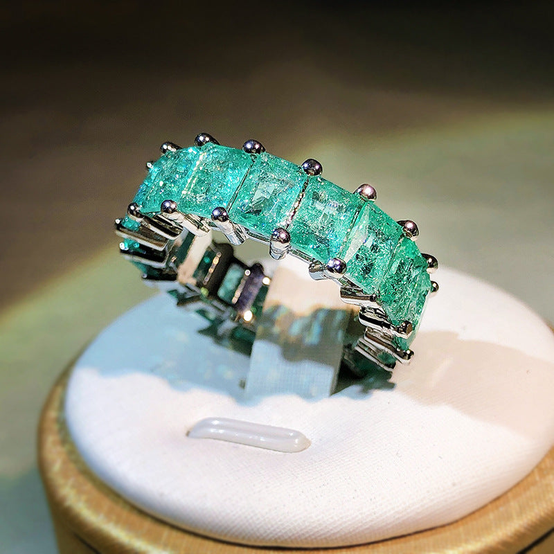 Anello quadrato affiancato con tormalina Paraiba Olivenorma