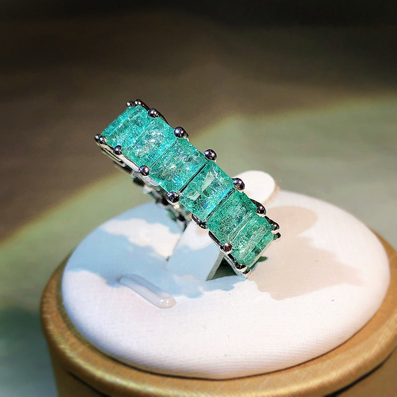 Anello quadrato affiancato con tormalina Paraiba Olivenorma
