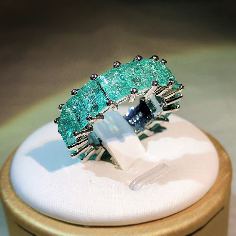 Anello quadrato affiancato con tormalina Paraiba Olivenorma