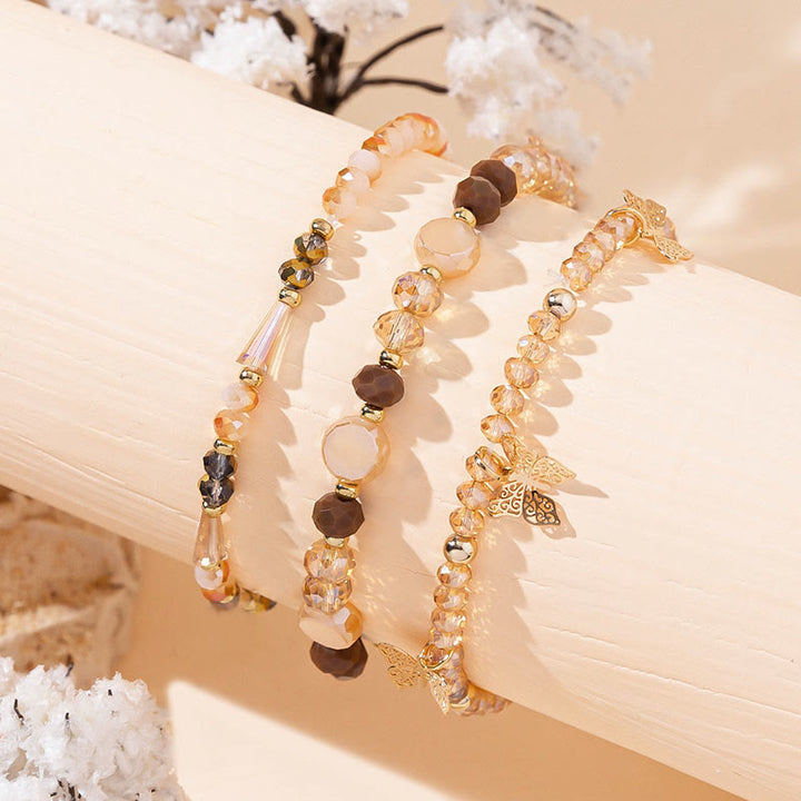 Olivenorma - Set di bracciali a tre strati con ciondolo a farfalla in oro con perline di cristallo