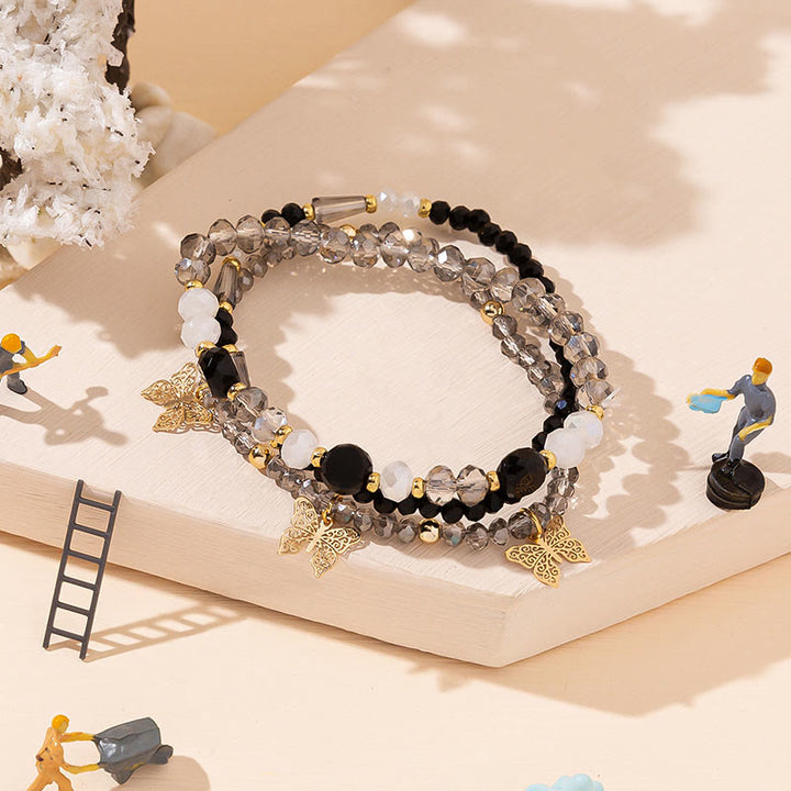 Olivenorma - Set di bracciali a tre strati con ciondolo a farfalla in oro con perline di cristallo