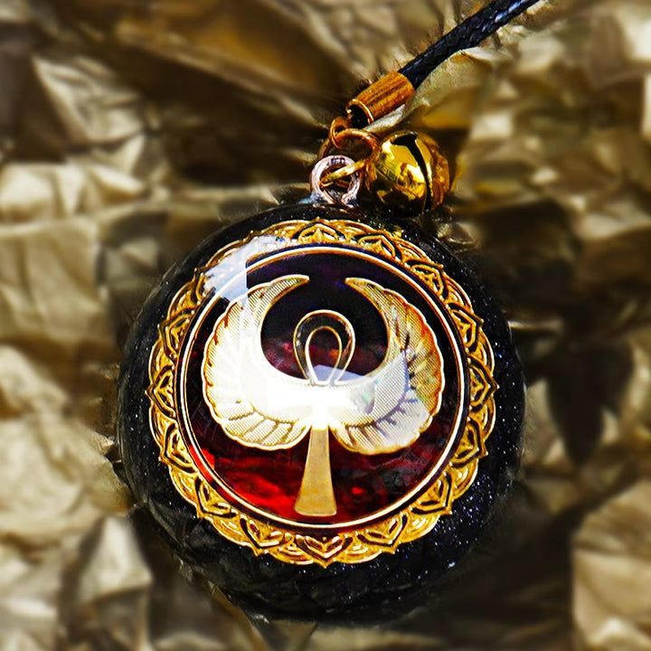 Collana Olivenorma in arenaria blu, agata rossa e OM Orgone