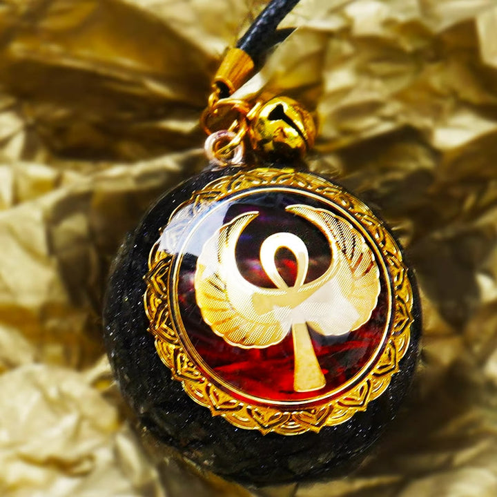 Collana Olivenorma in arenaria blu, agata rossa e OM Orgone