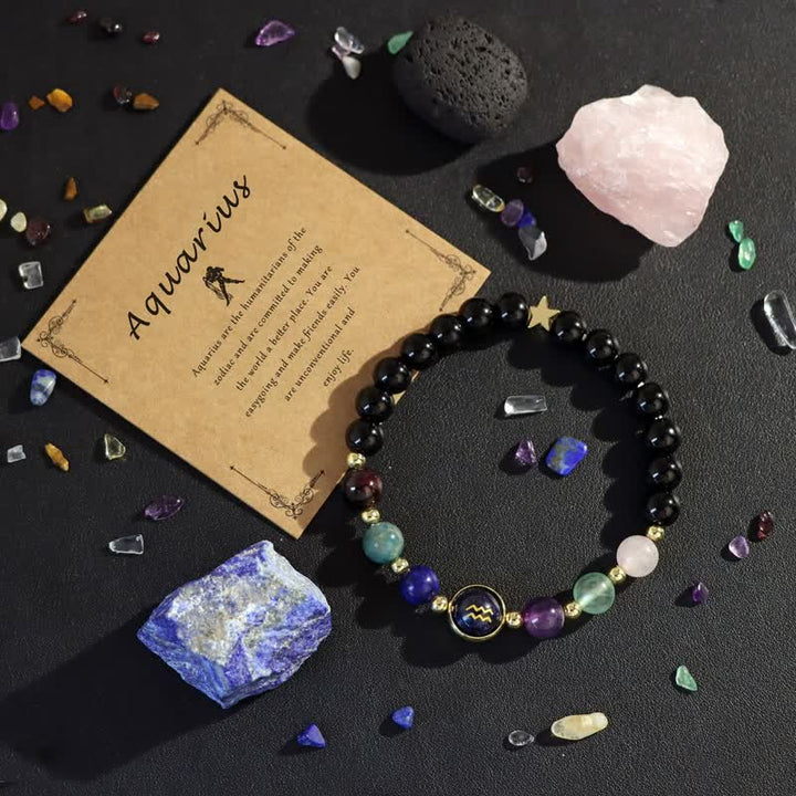 Bracciale Olivenorma con perline in ice nero e arenaria blu con zodiaco 