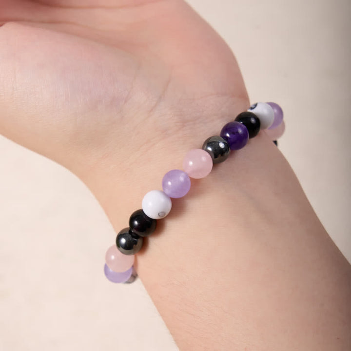 Bracciale Olivenorma con perline di quarzo rosa, ametista, ossidiana ematite 