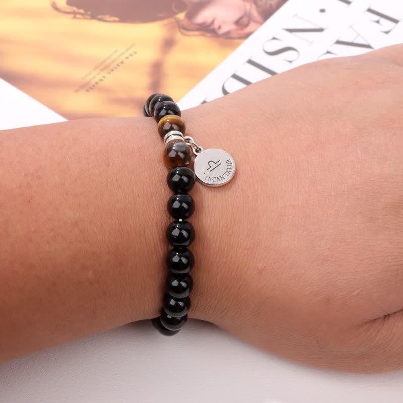 Bracciale con ciondolo zodiacale in perline di occhio di tigre in ossidiana Olivenorma