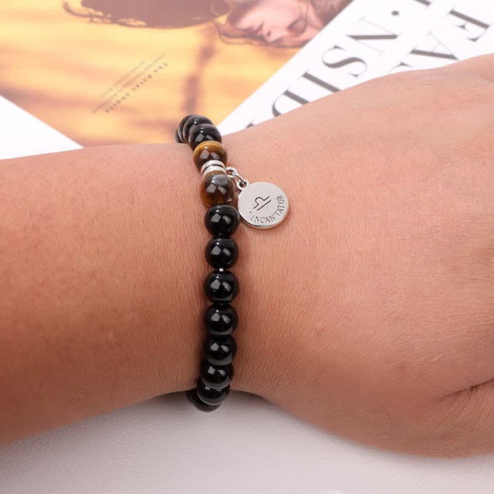 Bracciale con ciondolo zodiacale in perline di occhio di tigre in ossidiana Olivenorma
