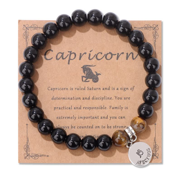 Bracciale con ciondolo zodiacale in perline di occhio di tigre in ossidiana Olivenorma
