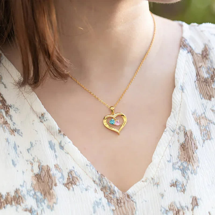 Collana personalizzata Olivenorma con pietra portafortuna a forma di cuore con 1-6 nomi incisi
