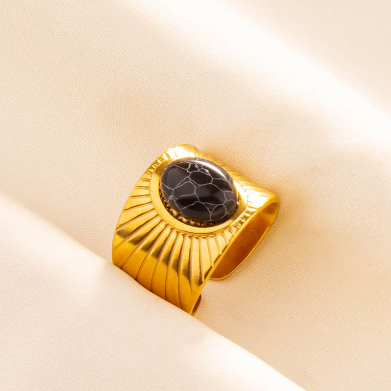 Olivenorma Anello largo regolabile in pietra naturale ovale intarsiata