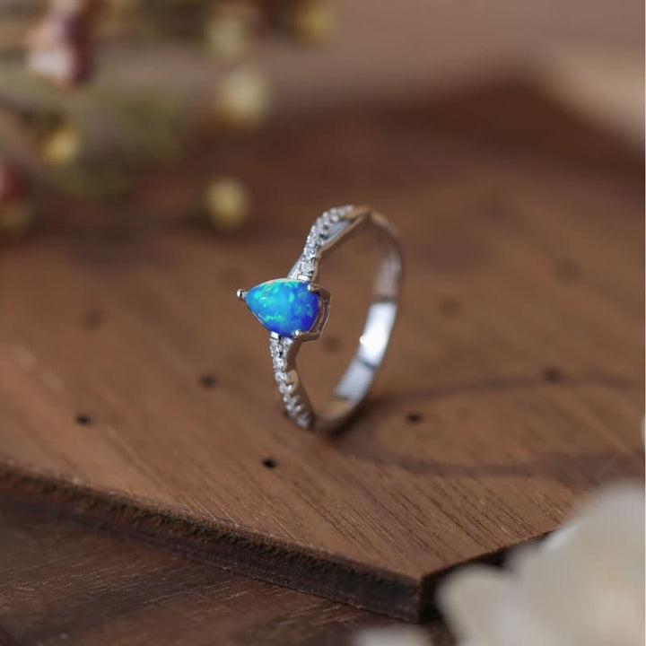 Olivenorma Goccia d'acqua Opale blu Zircone bianco