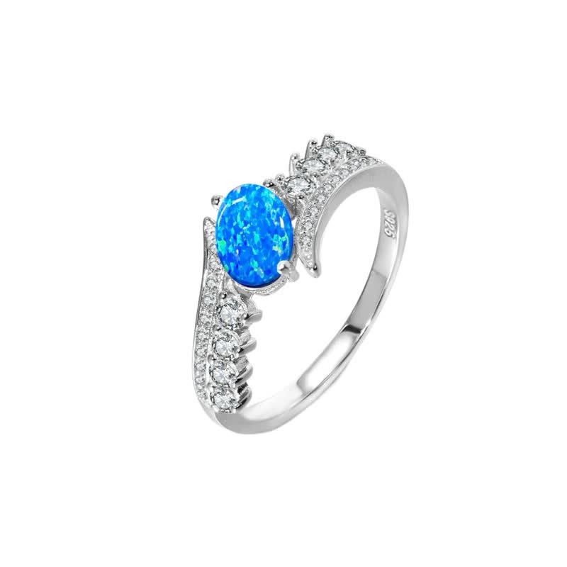 Anello Olivenorma con ali avvolte in opale blu naturale 
