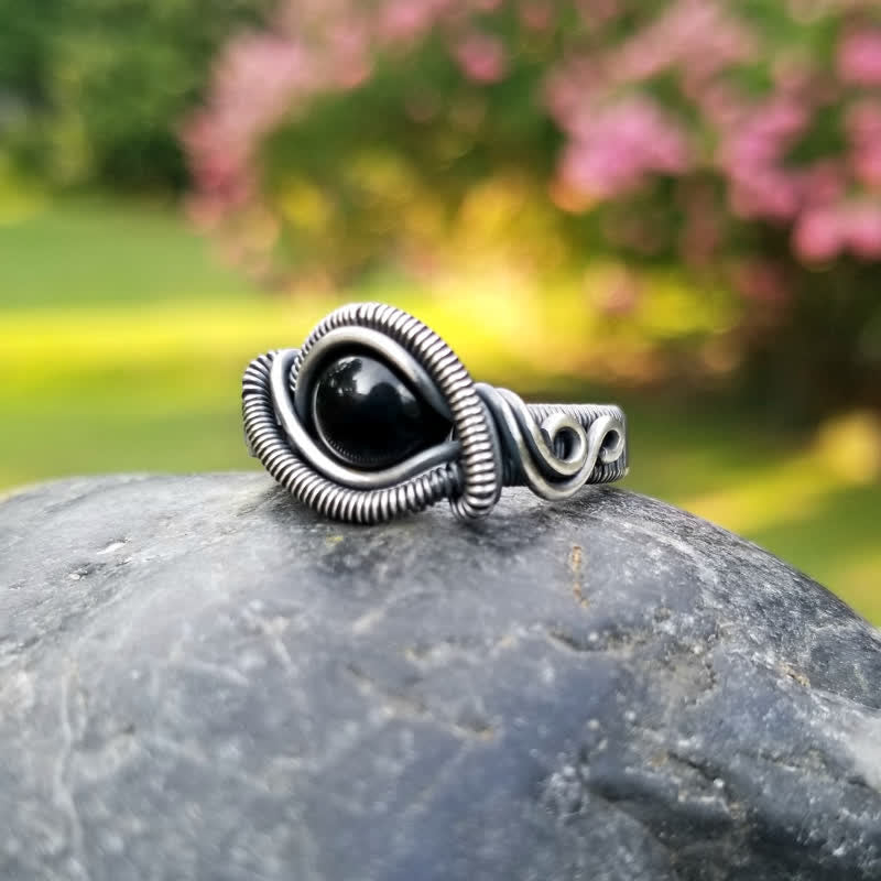 Olivenorma Anello da uomo con nodo in onice nero avvolto in filo