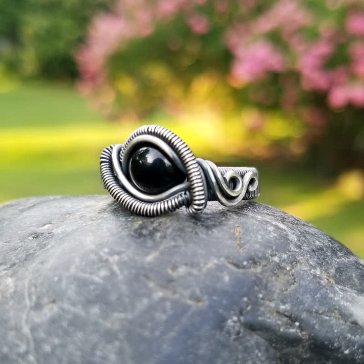 Olivenorma Anello da uomo con nodo in onice nero avvolto in filo