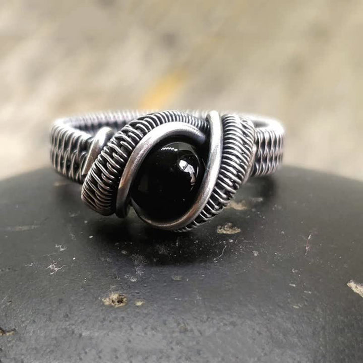 Olivenorma Anello da uomo con nodo in onice nero avvolto in filo