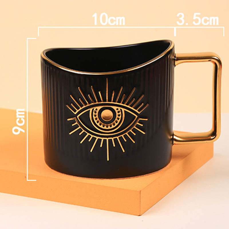 Tazza da caffè in ceramica con manico dorato e malocchio Olivenorma